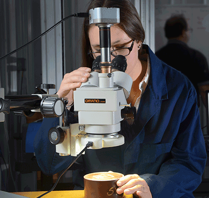 looking through microscope